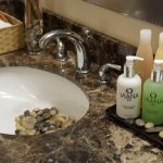 marble bathroom sink with amenities